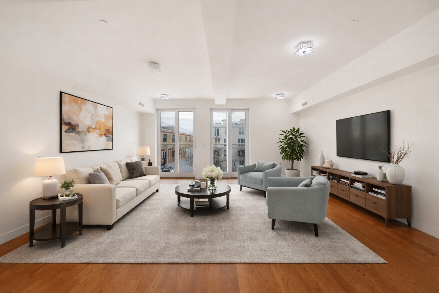 3112 Emmons Avenue, Unit 206 Brooklyn, NY 11235 - Photo 1 of 10 a living room with furniture and a flat screen tv