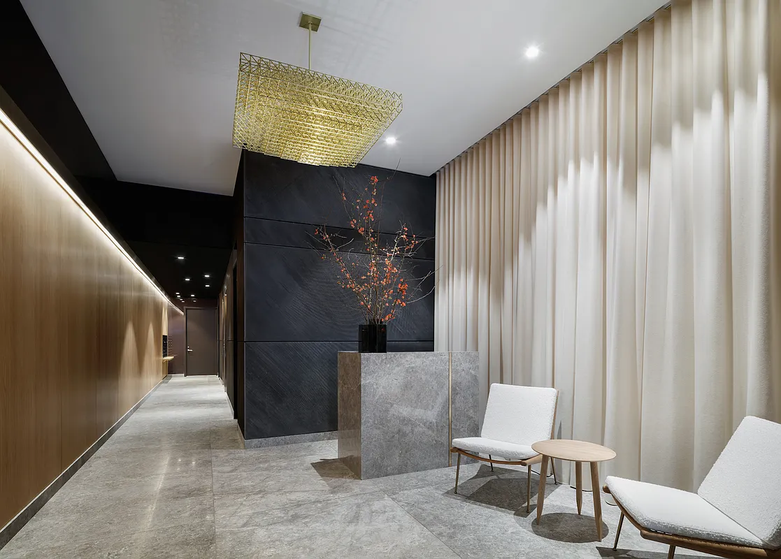 30 Warren Street, Unit 2C Manhattan, NY 10007 - Photo 14 of 18 a view of a hallway with furniture and window