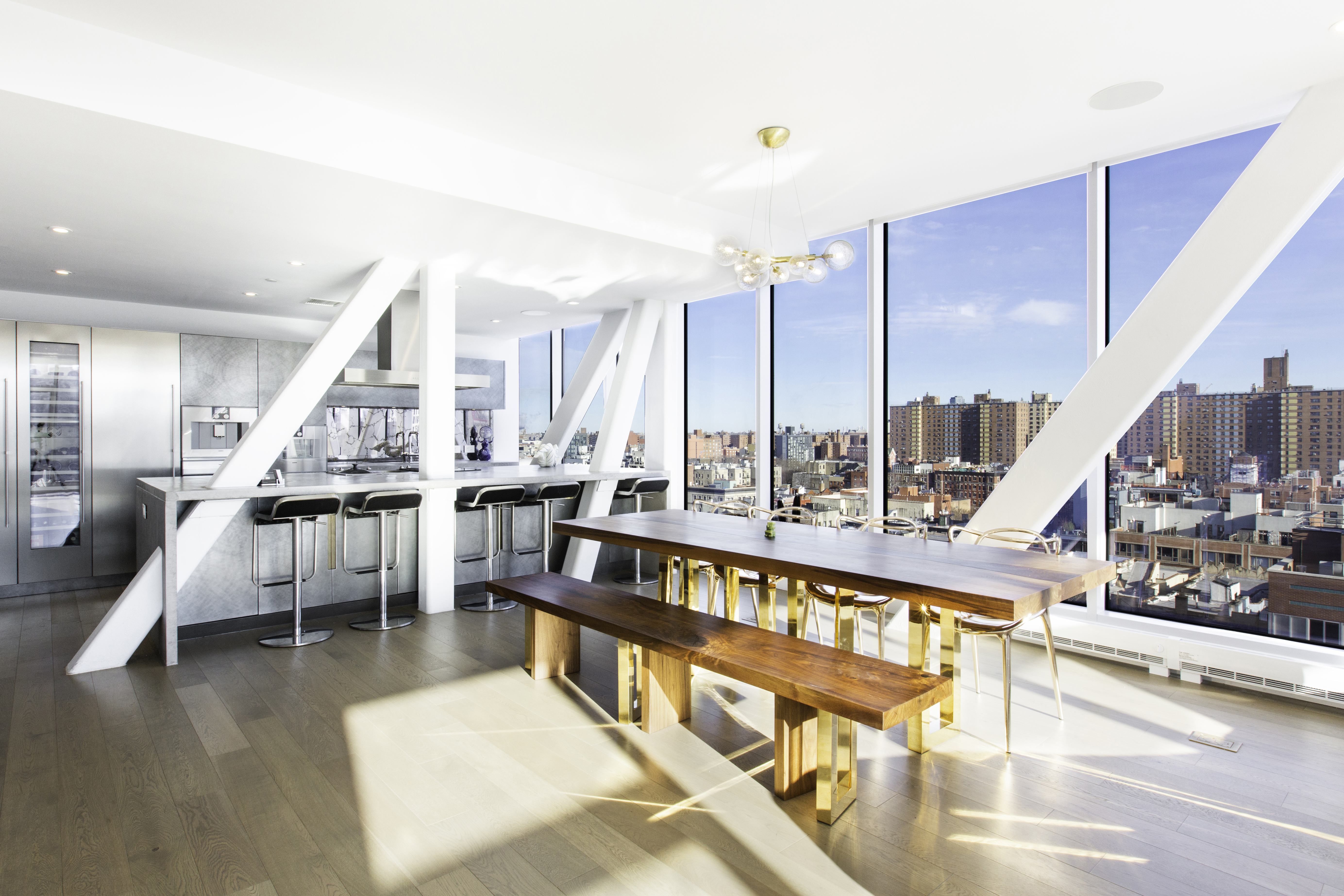 100 Norfolk Street, Unit PH Manhattan, NY 10002 - Photo 7 of 23 a living room with lots of furniture and a large window