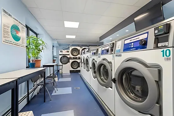 a view of a hallway with washer and dryer