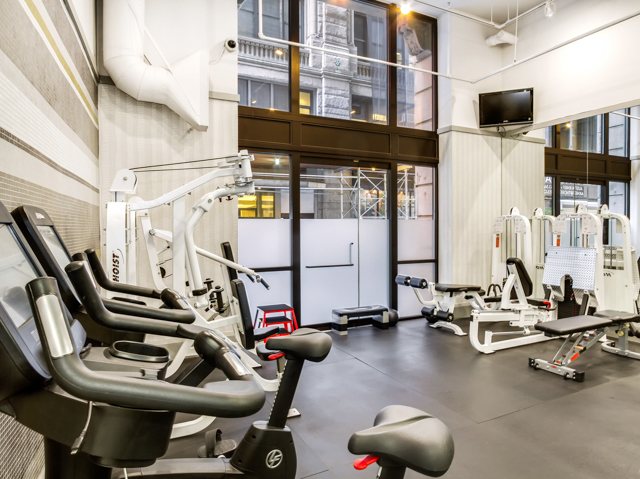 150 Nassau Street, Unit 19A Manhattan, NY 10038 - Photo 11 of 16 a view of a room with gym equipment