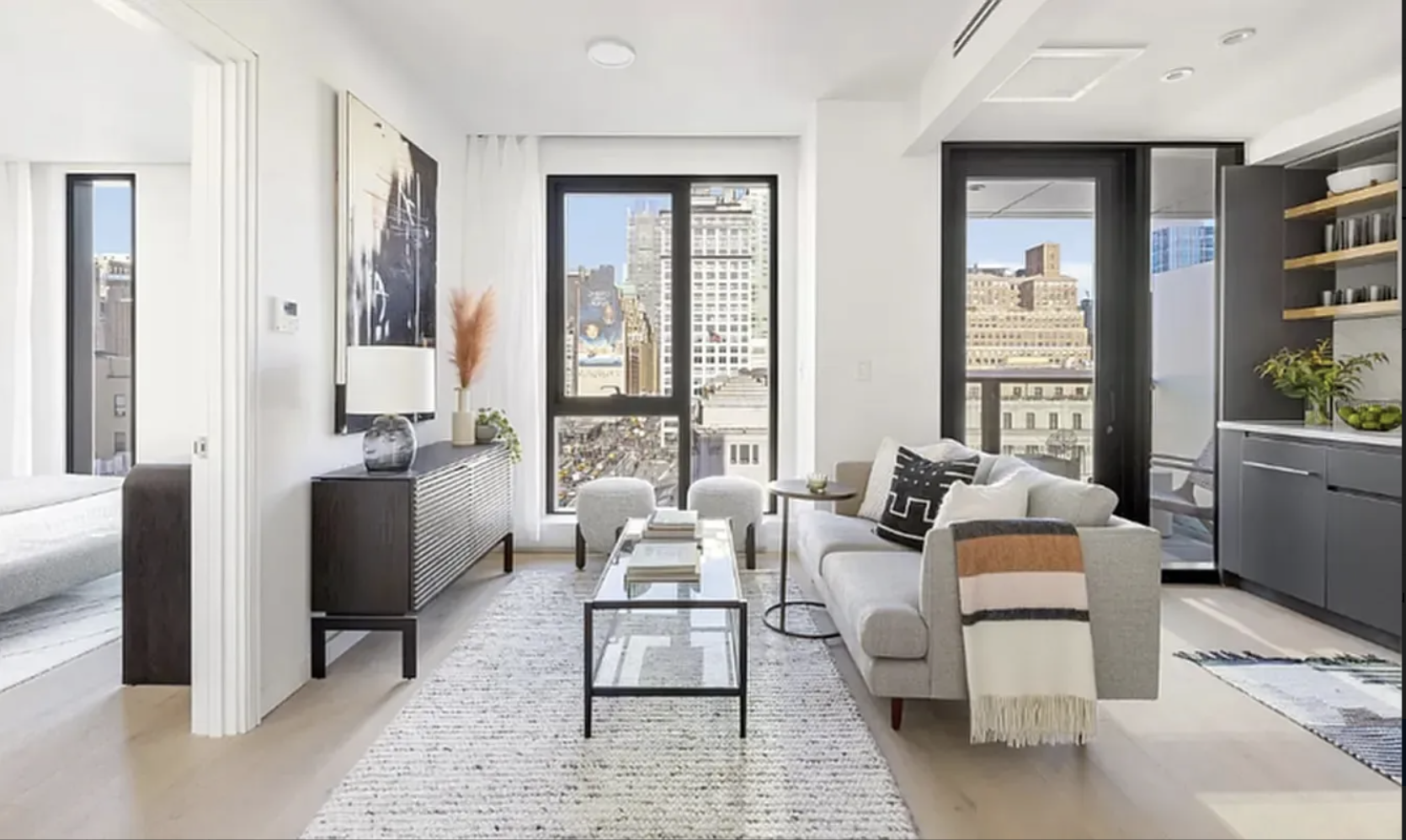 300 West 30th Street, Unit 4A Manhattan, NY 10001 - Photo 2 of 15 a living room with furniture and large window