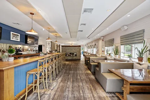 a kitchen with furniture wooden floor and a counter top space