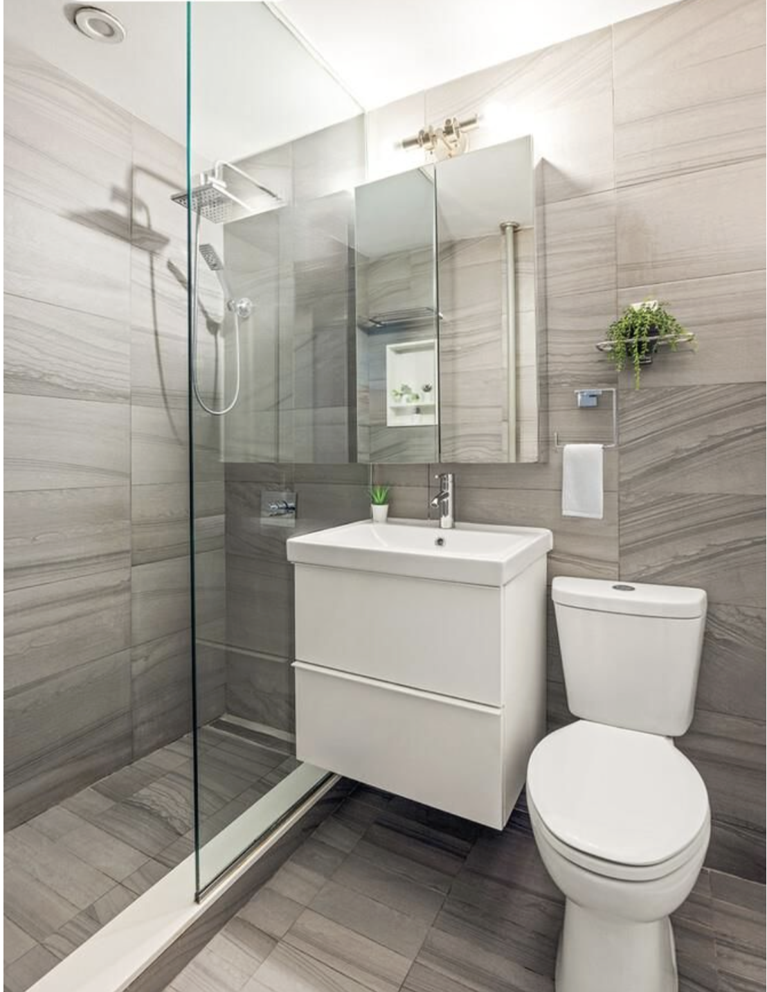 443 Hicks Street, Unit 2E Brooklyn, NY 11201 - Photo 7 of 12 a bathroom with a sink toilet and shower