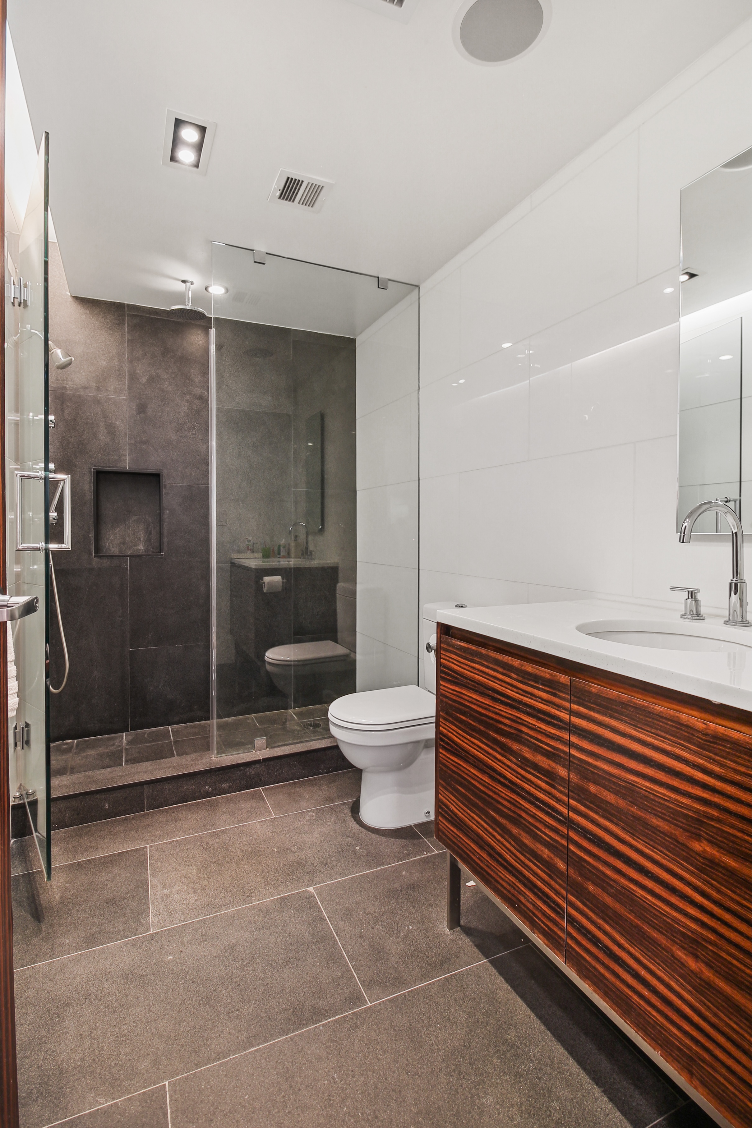 405 Broadway, Unit 4 Manhattan, NY 10013 - Photo 14 of 19 a bathroom with a sink a toilet and shower