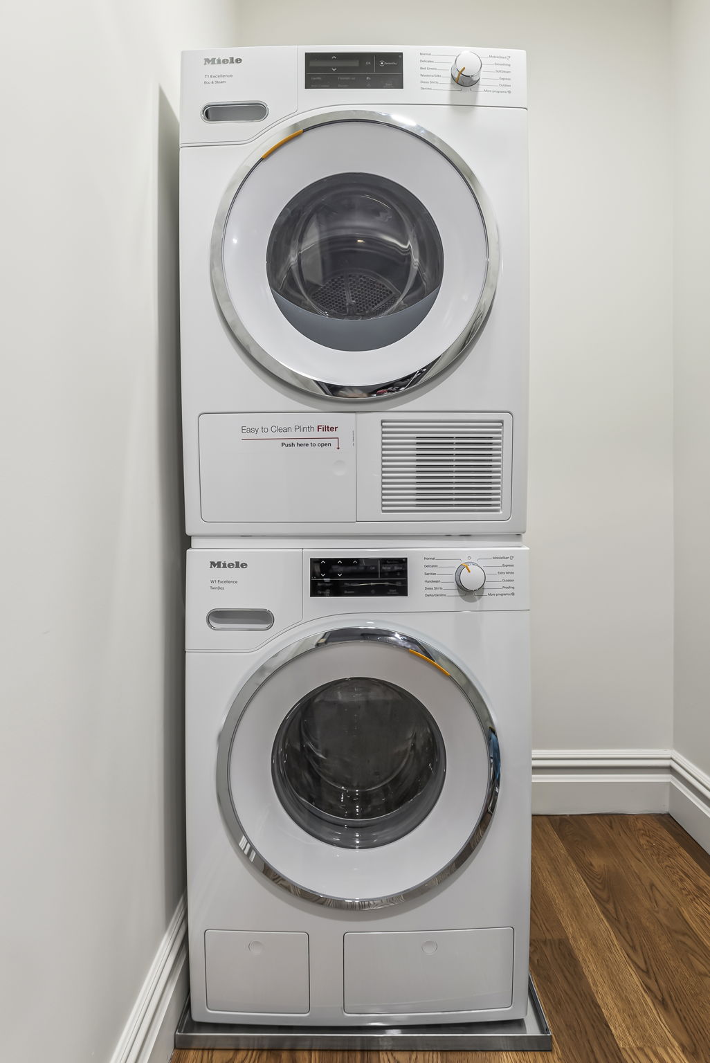 230 Central Park South, Unit 6DE Manhattan, NY 10019 - Photo 18 of 23 a utility room with dryer and washer