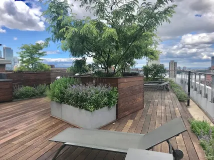 a view of a balcony with wooden floor