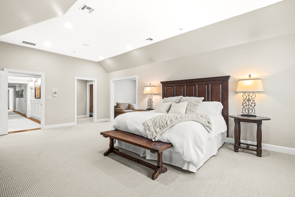 Country Way Needham, MA 02492 - Photo 15 of 27 a spacious bedroom with a bed and a lamp