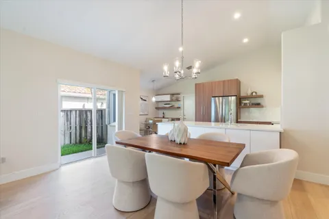 a kitchen with stainless steel appliances a refrigerator and a stove