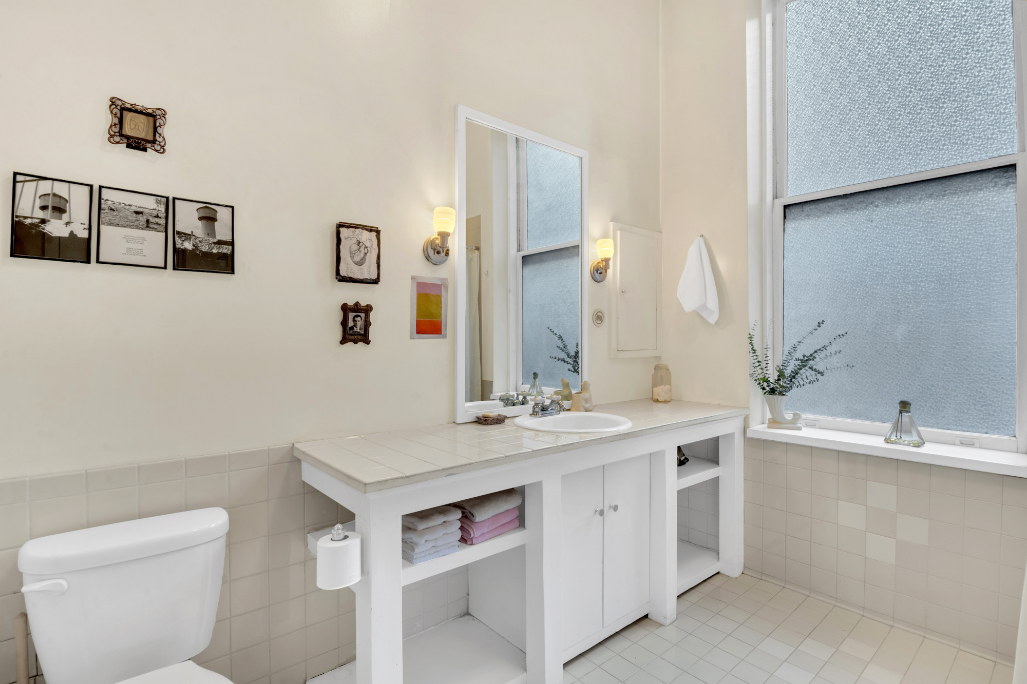 69 Wooster Street, Unit 3 Manhattan, NY 10012 - Photo 14 of 22 a bathroom with a sink and a toilet