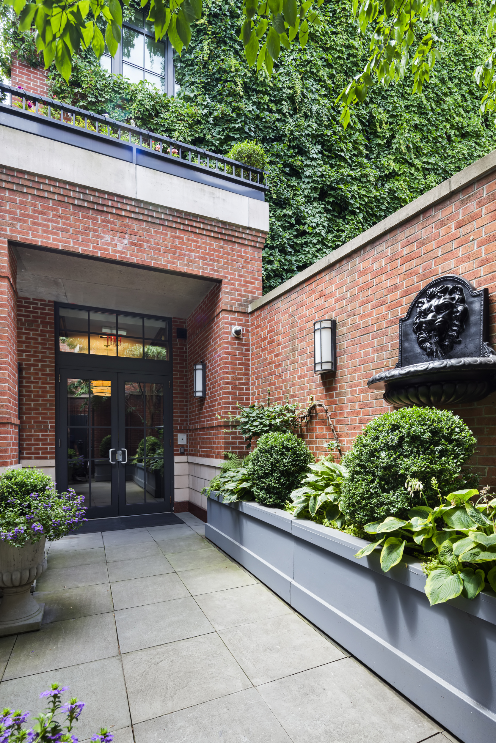 744 Greenwich Street, Unit 4 Manhattan, NY 10014 - Photo 32 of 34 a front view of a house with a yard