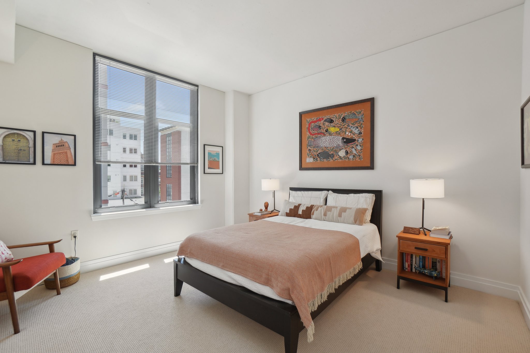 2120 Vermont Avenue Northwest, Unit 309 Washington, DC 20001 - Photo 11 of 26 a bedroom with a bed and a painting on the wall