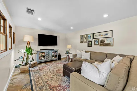 a living room with furniture and a large window