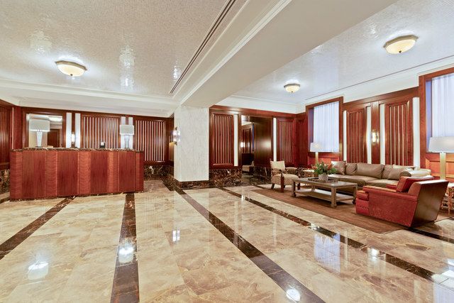 160 West 12th Street, Unit 104 Manhattan, NY 10011 - Photo 20 of 28 a lobby with furniture and large windows