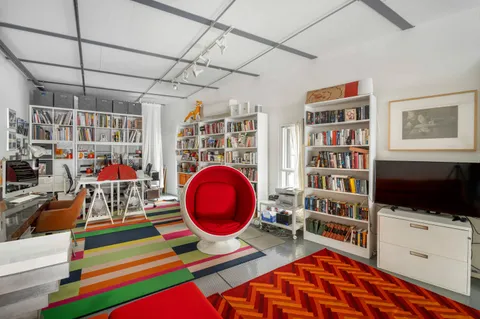 a room with furniture and a flat screen tv