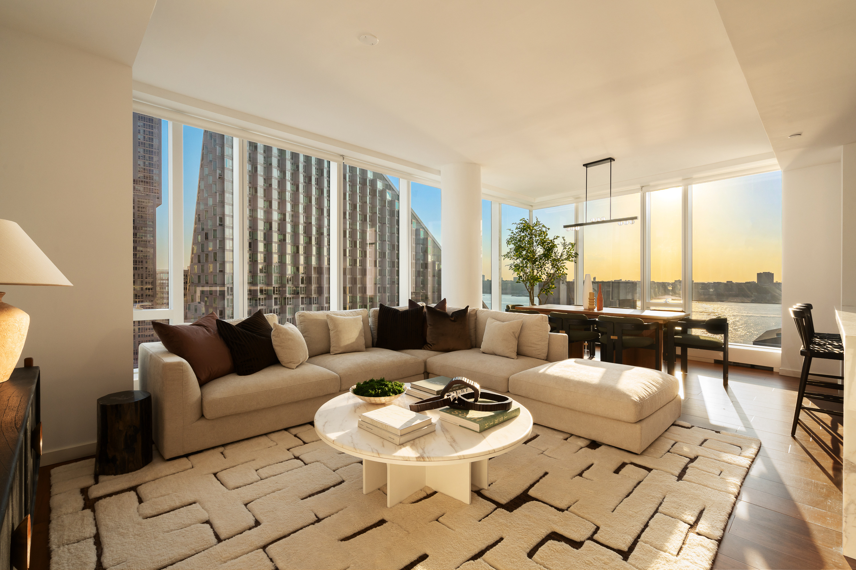 1 West End Avenue, Unit 15J Manhattan, NY 10023 - Photo 2 of 20 a living room with furniture and a large window