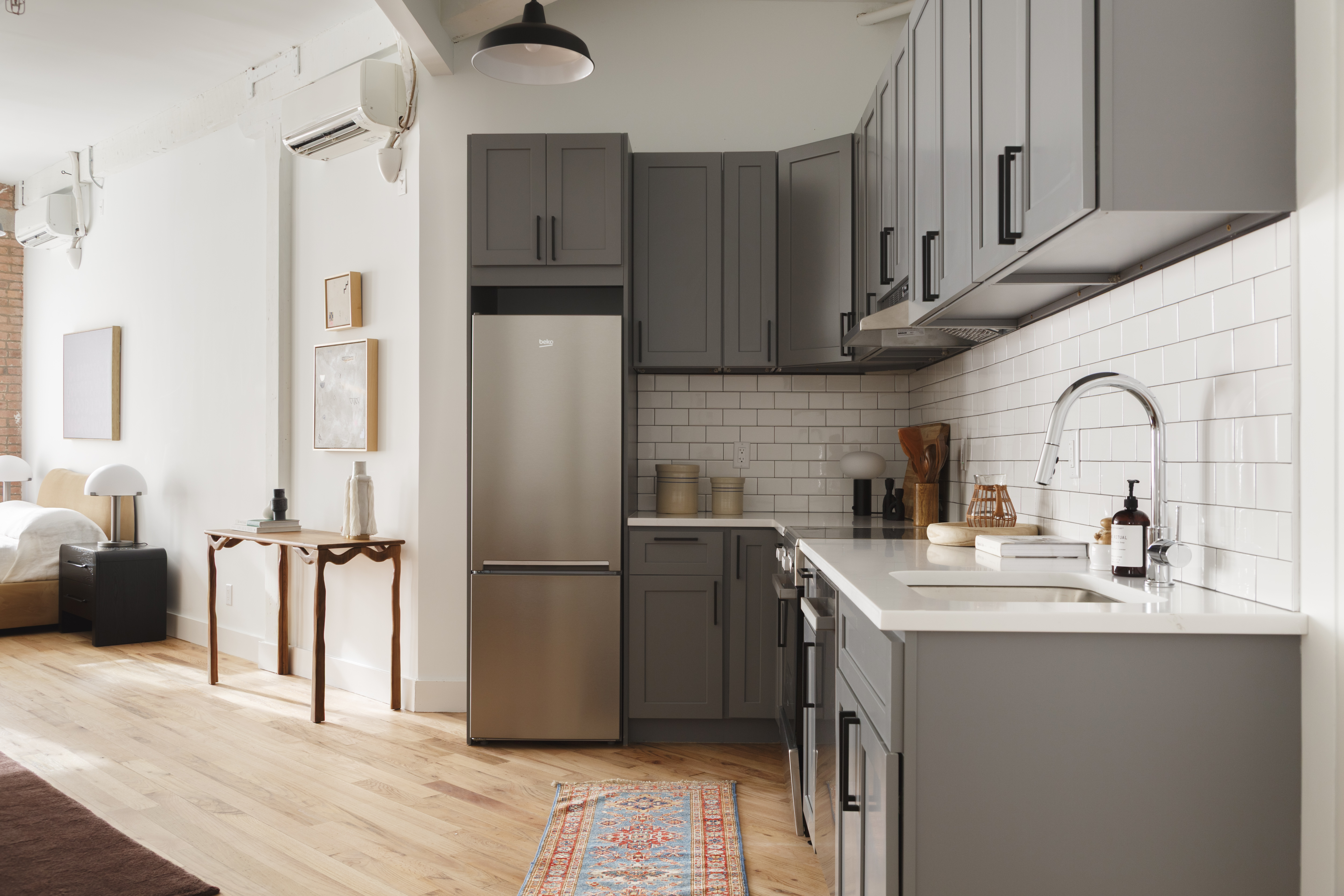 239 Banker Street, Unit 2G Brooklyn, NY 11222 - Photo 9 of 13 a kitchen with stainless steel appliances a refrigerator sink and cabinets