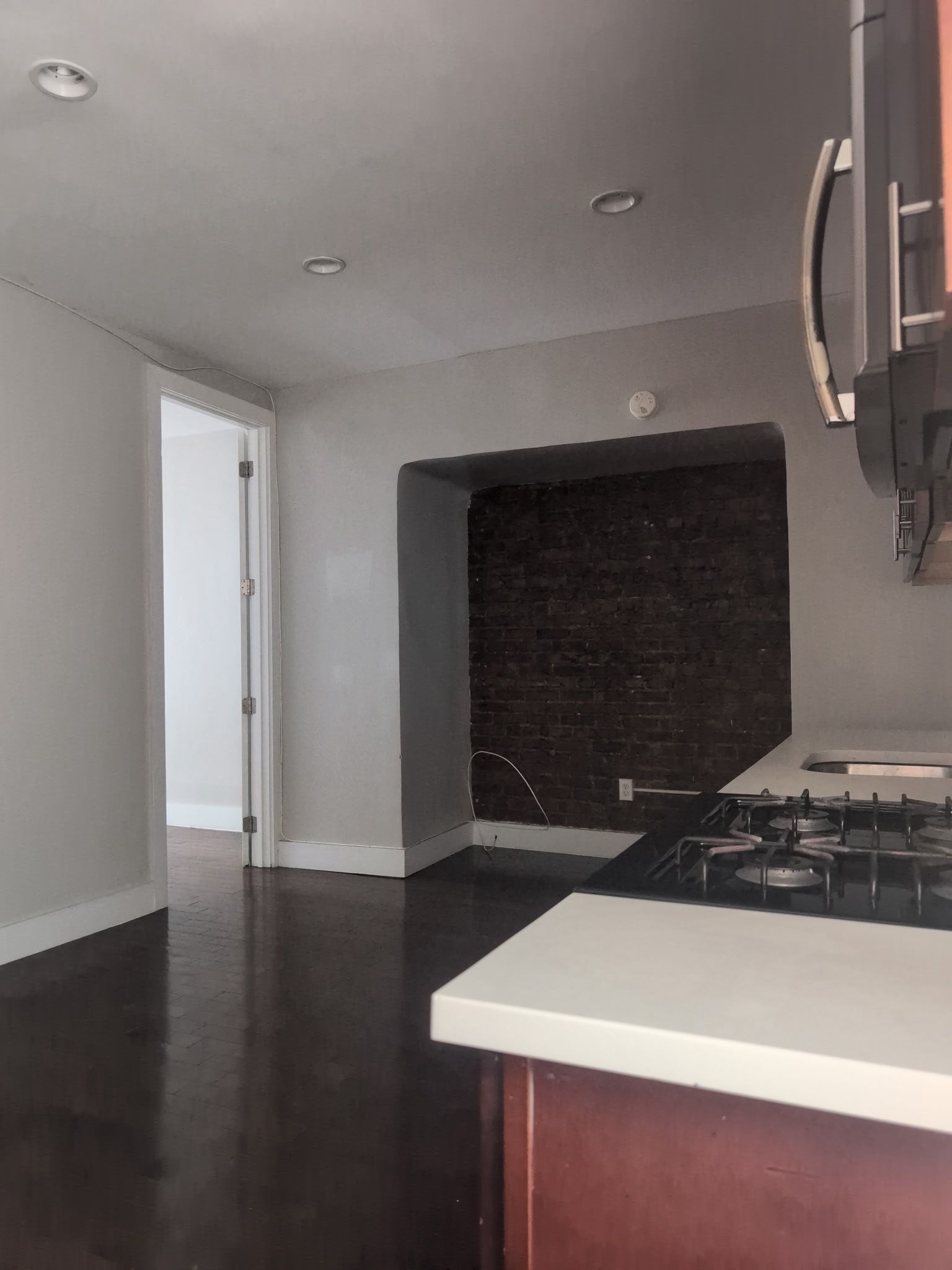 2405 Nostrand Avenue, Unit 6 Brooklyn, NY 11210 - Photo 3 of 11 a room with wooden floor and a fireplace
