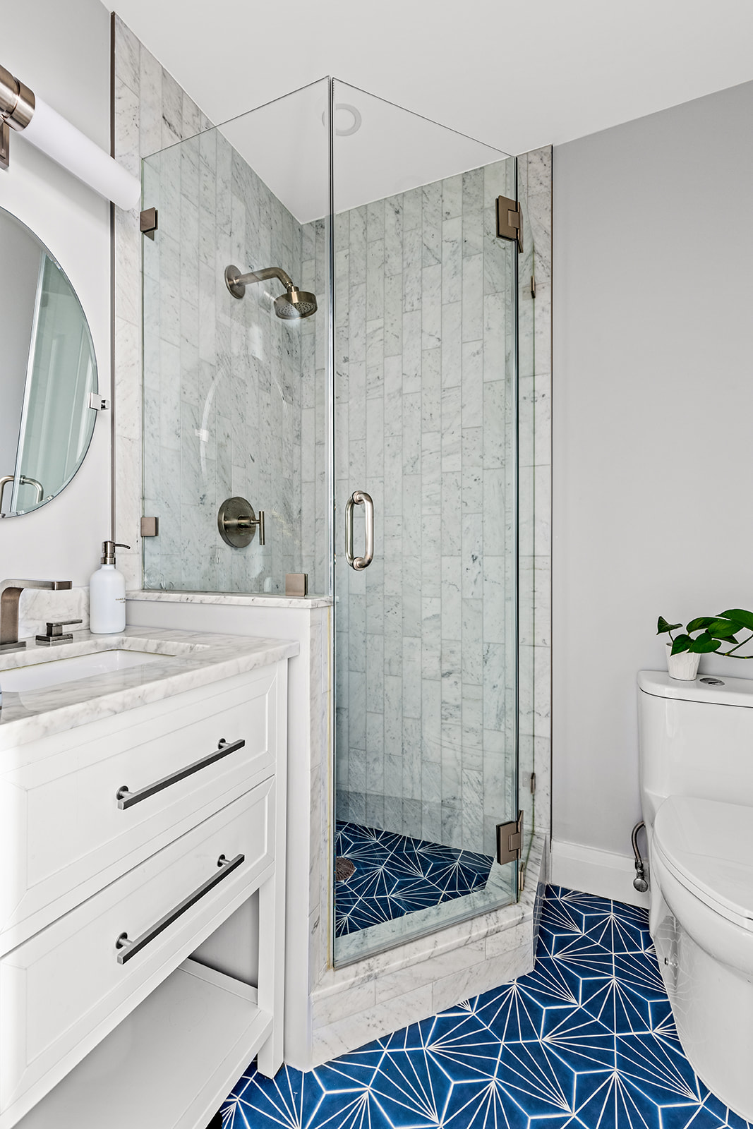 330 Bergen Street, Unit 3D Brooklyn, NY 11217 - Photo 5 of 11 a bathroom with a shower sink and mirror
