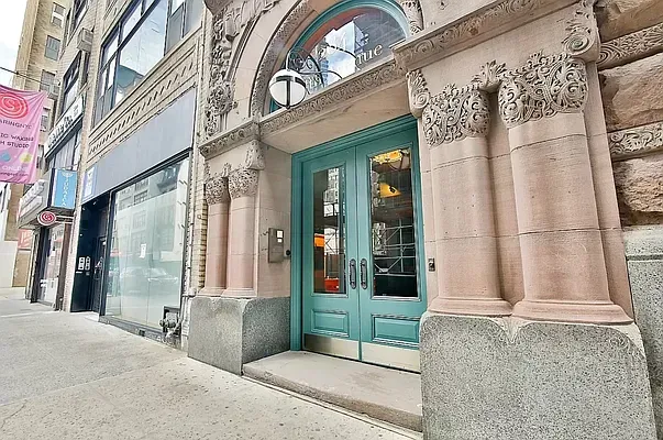 a view of a building with a door and windows