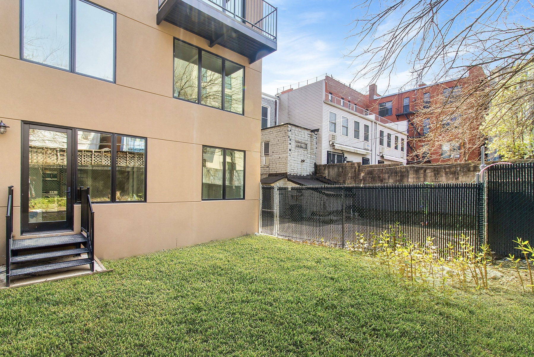 1098 Madison Street, Unit 1B Brooklyn, NY 11221 - Photo 12 of 16 a view of house with backyard and swimming pool