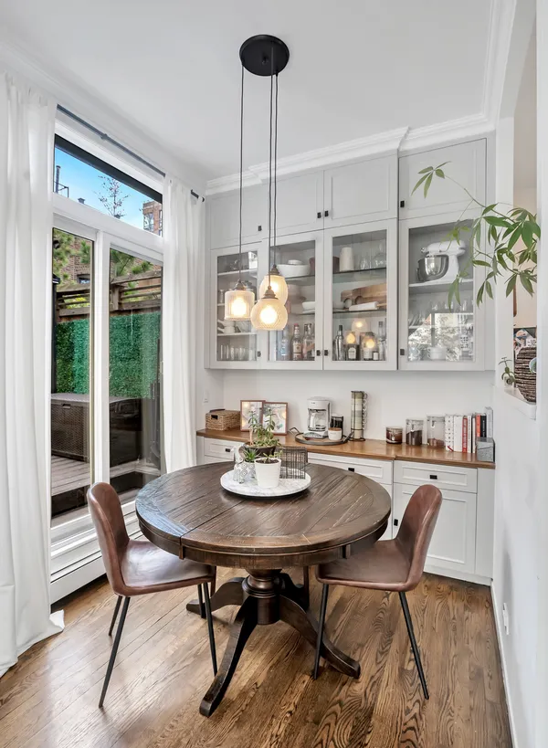 a view of a dining room with furniture window and outside view
