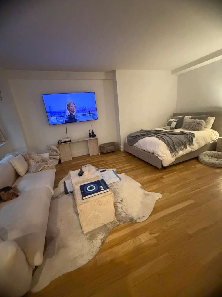 116 Central Park South, Unit 3G Manhattan, NY 10019 - Photo 6 of 8 a bedroom with a bed and a couch