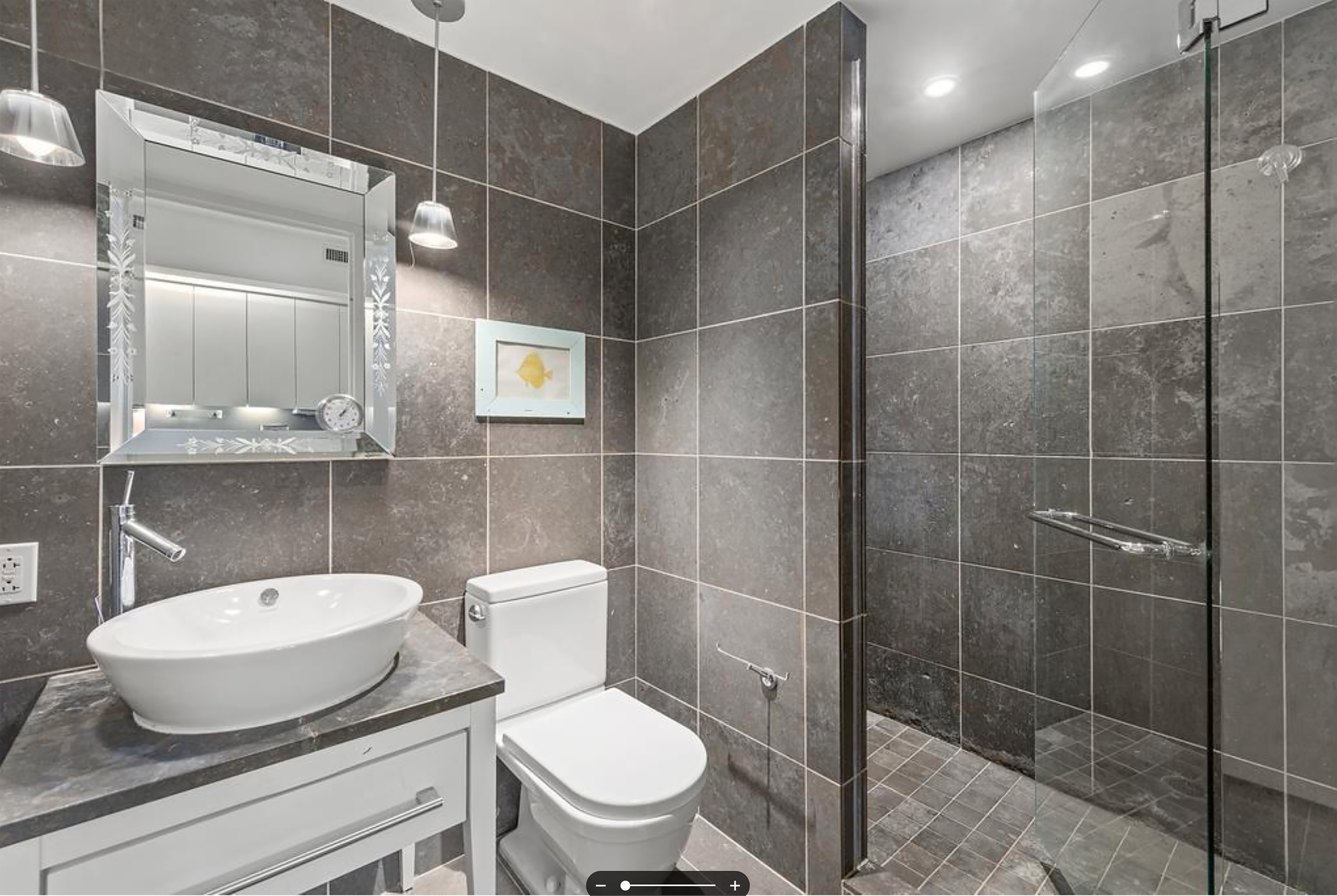 340 East 23rd Street, Unit 9J Manhattan, NY 10010 - Photo 4 of 5 a bathroom with a toilet and a mirror