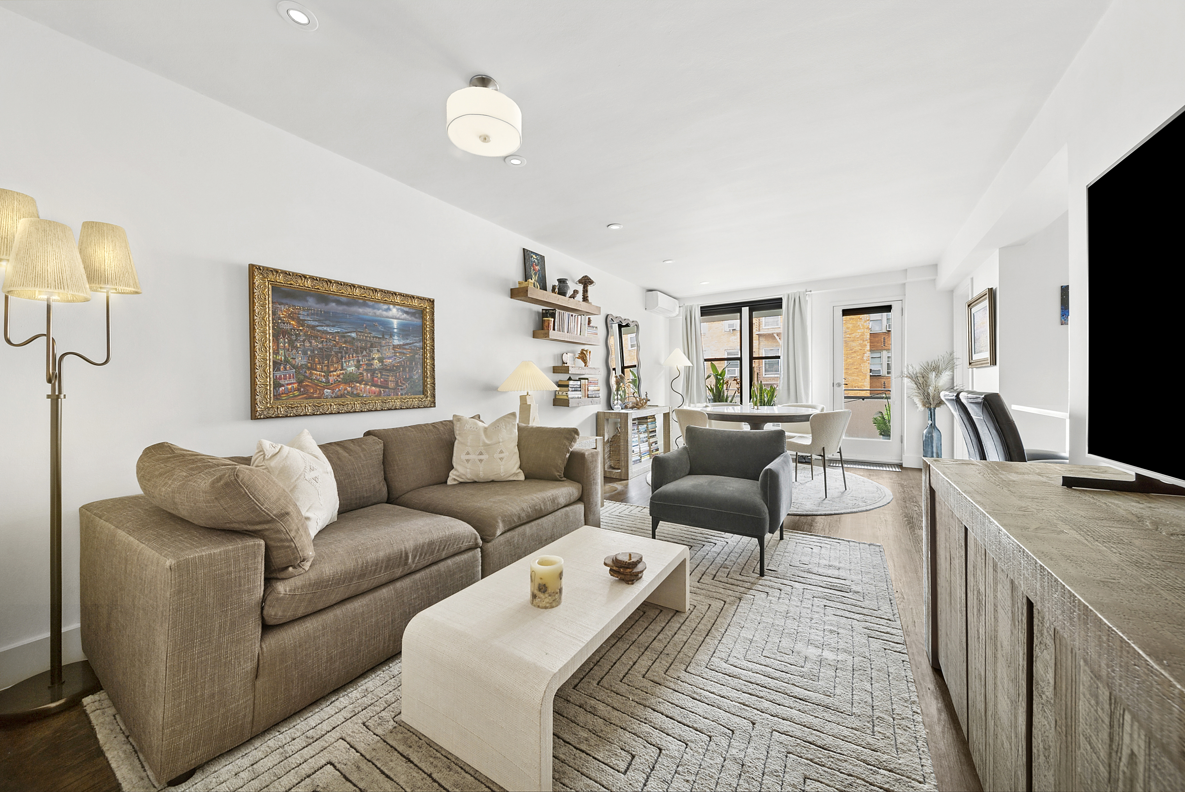 9511 Shore Road, Unit 505 Brooklyn, NY 11209 - Photo 2 of 18 a living room with furniture and a flat screen tv
