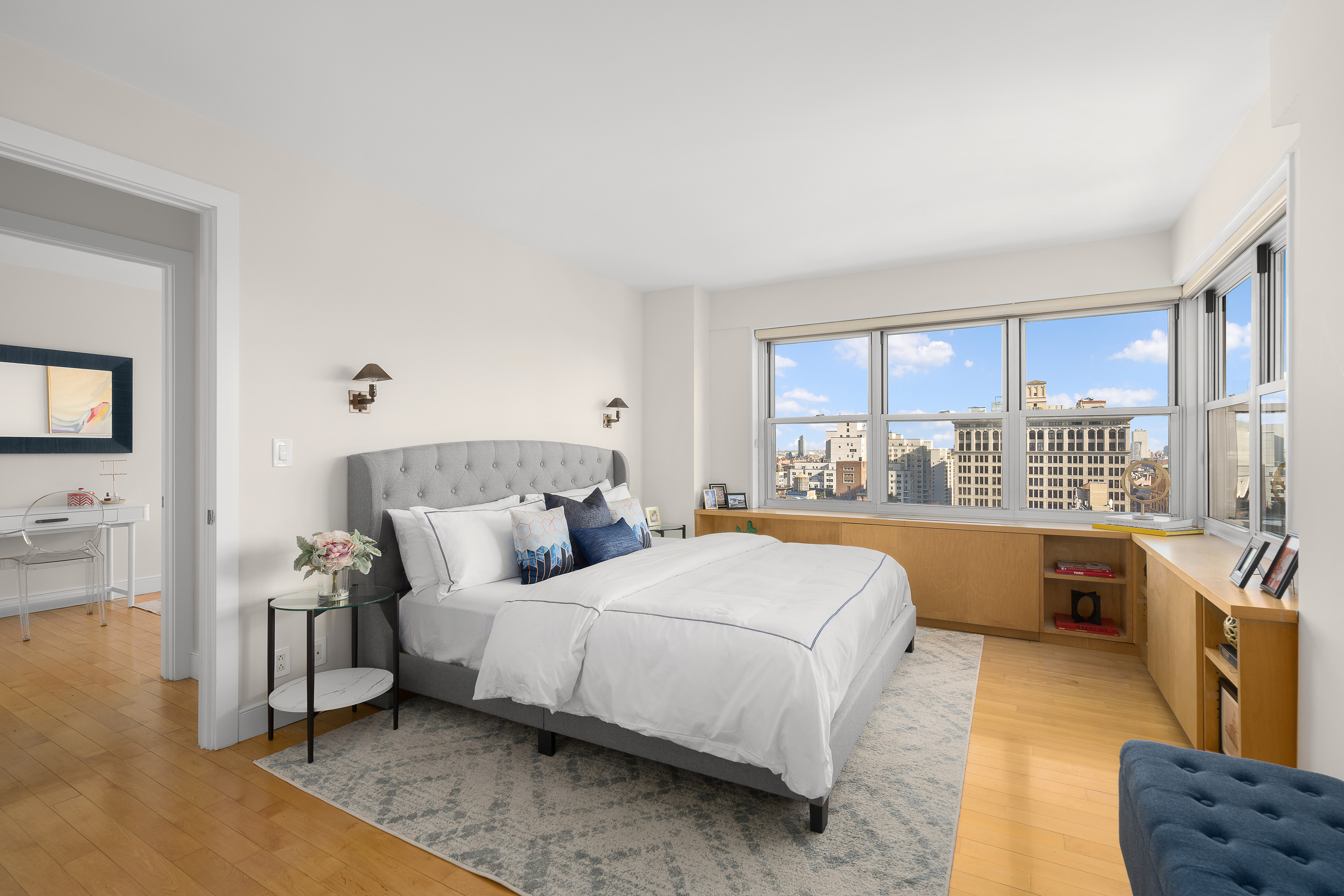 20 East 9th Street, Unit 22C Manhattan, NY 10003 - Photo 5 of 21 a bedroom with a large bed and a window
