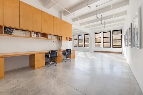 a room with lots of table and chairs