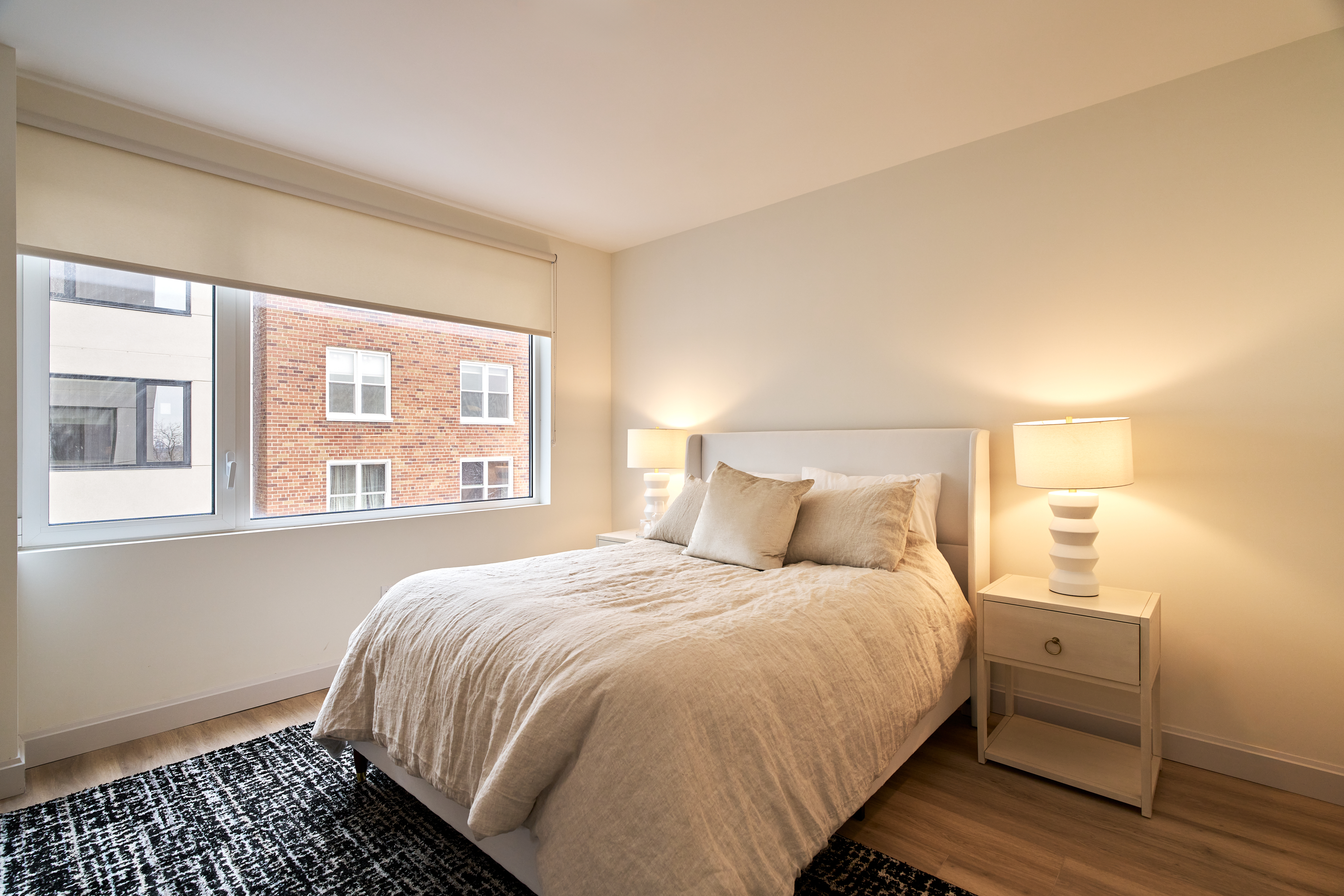 4414 Douglaston Parkway, Unit 6C Queens, NY 11363 - Photo 5 of 14 a bedroom with a bed and a window