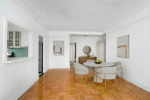 a living room with furniture and a table