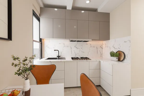 a kitchen with stainless steel appliances kitchen island granite countertop a sink a stove white cabinets and wooden floor