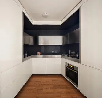 a kitchen with stainless steel appliances granite countertop a stove and a refrigerator
