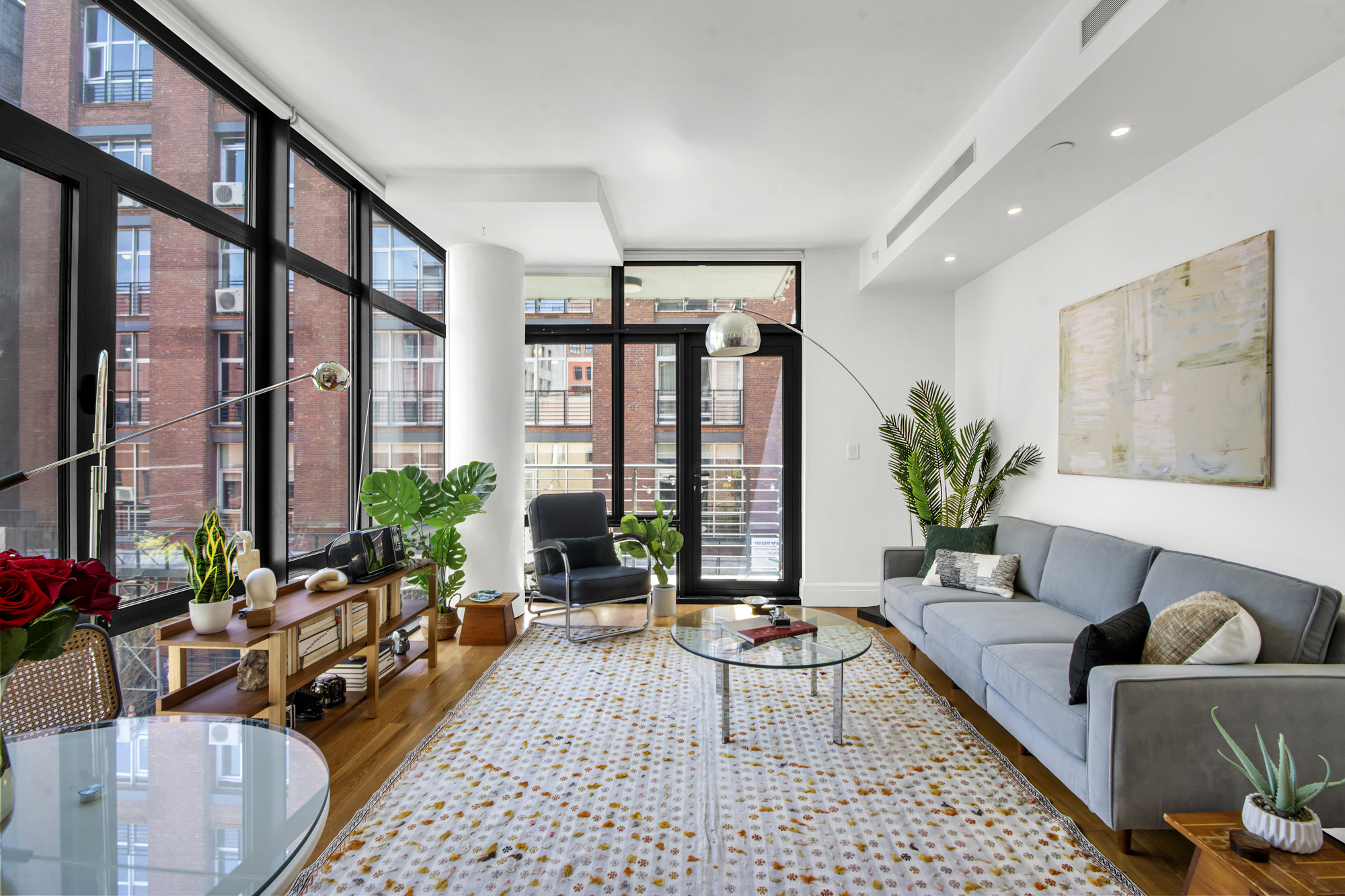 47 Bridge Street, Unit 3DD Brooklyn, NY 11201 - Photo 2 of 24 a living room with furniture and flowers