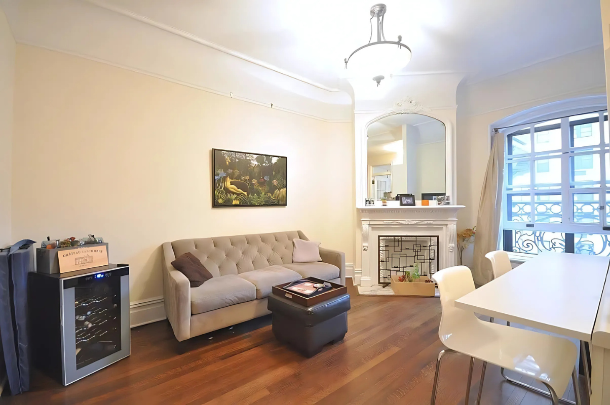 2109 Broadway, Unit 531 Manhattan, NY 10023 - Photo 1 of 8 a living room with furniture and a fireplace