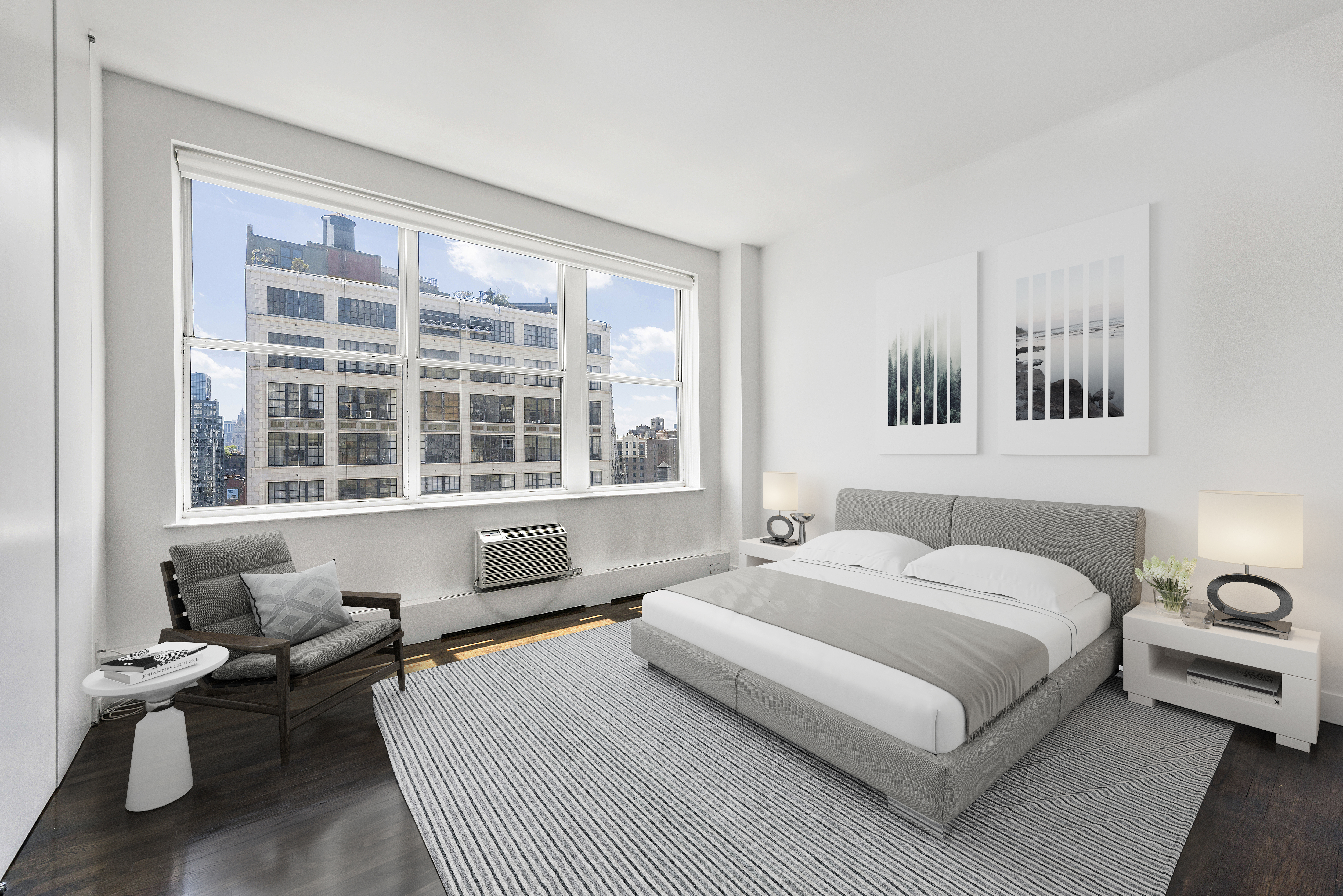 114 East 13th Street, Unit PHA Manhattan, NY 10003 - Photo 4 of 8 a bedroom with a bed and a large window