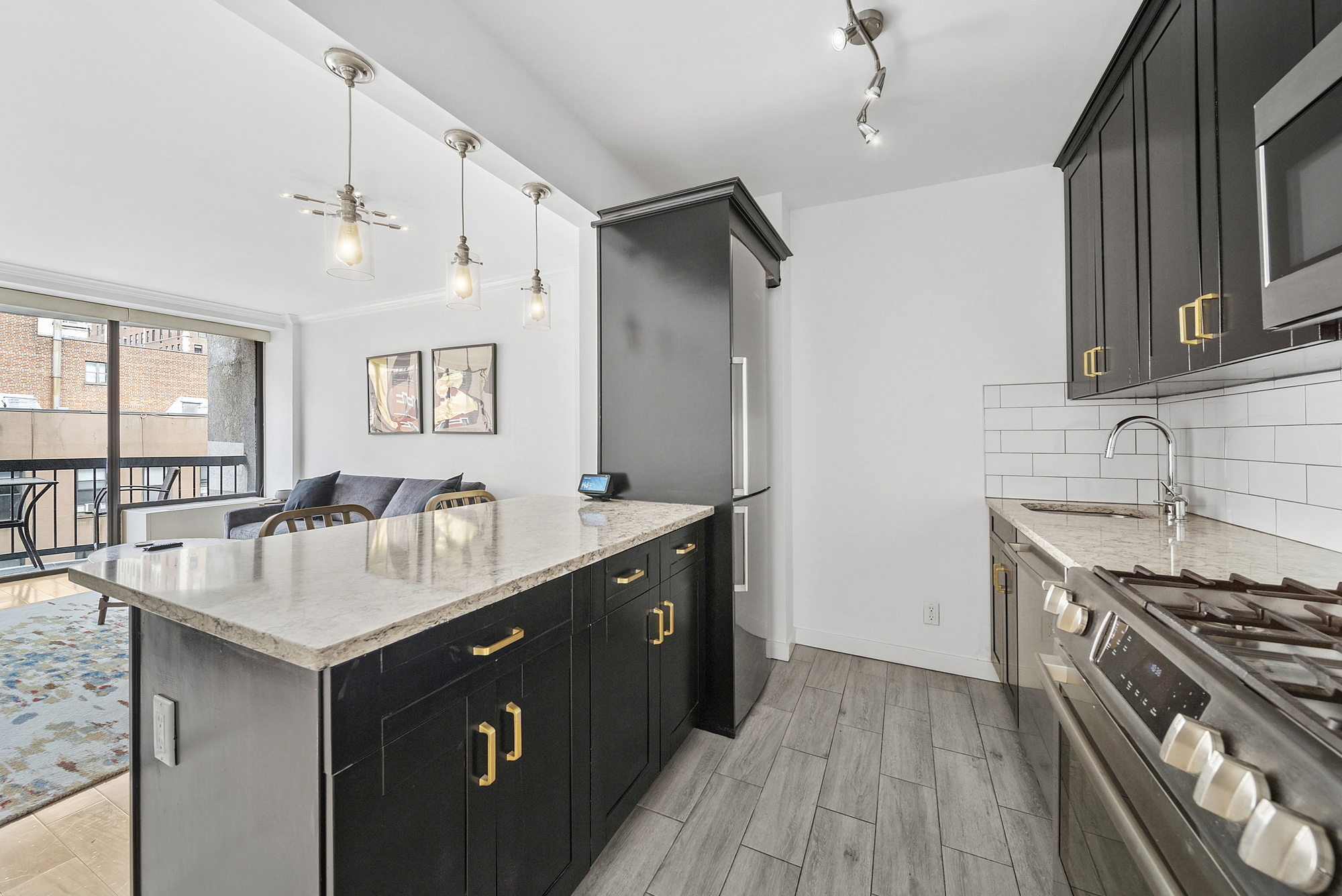 150 East 85th Street, Unit 5F Manhattan, NY 10028 - Photo 2 of 9 a kitchen with sink stove and cabinets