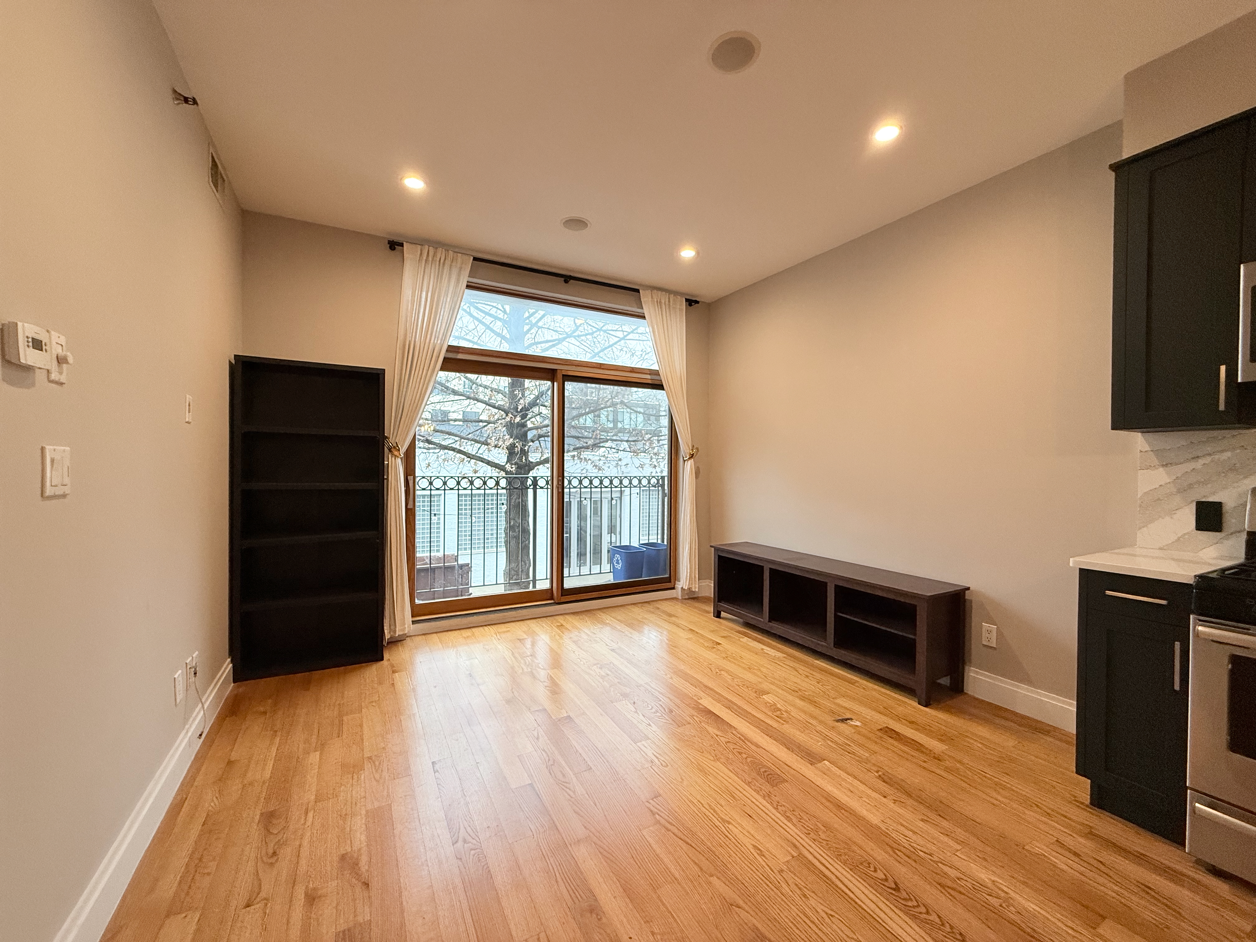 a view of workspace with wooden floor and windows