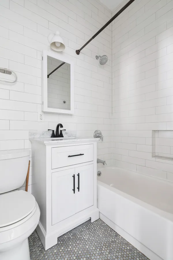 a bathroom with a sink toilet and vanity