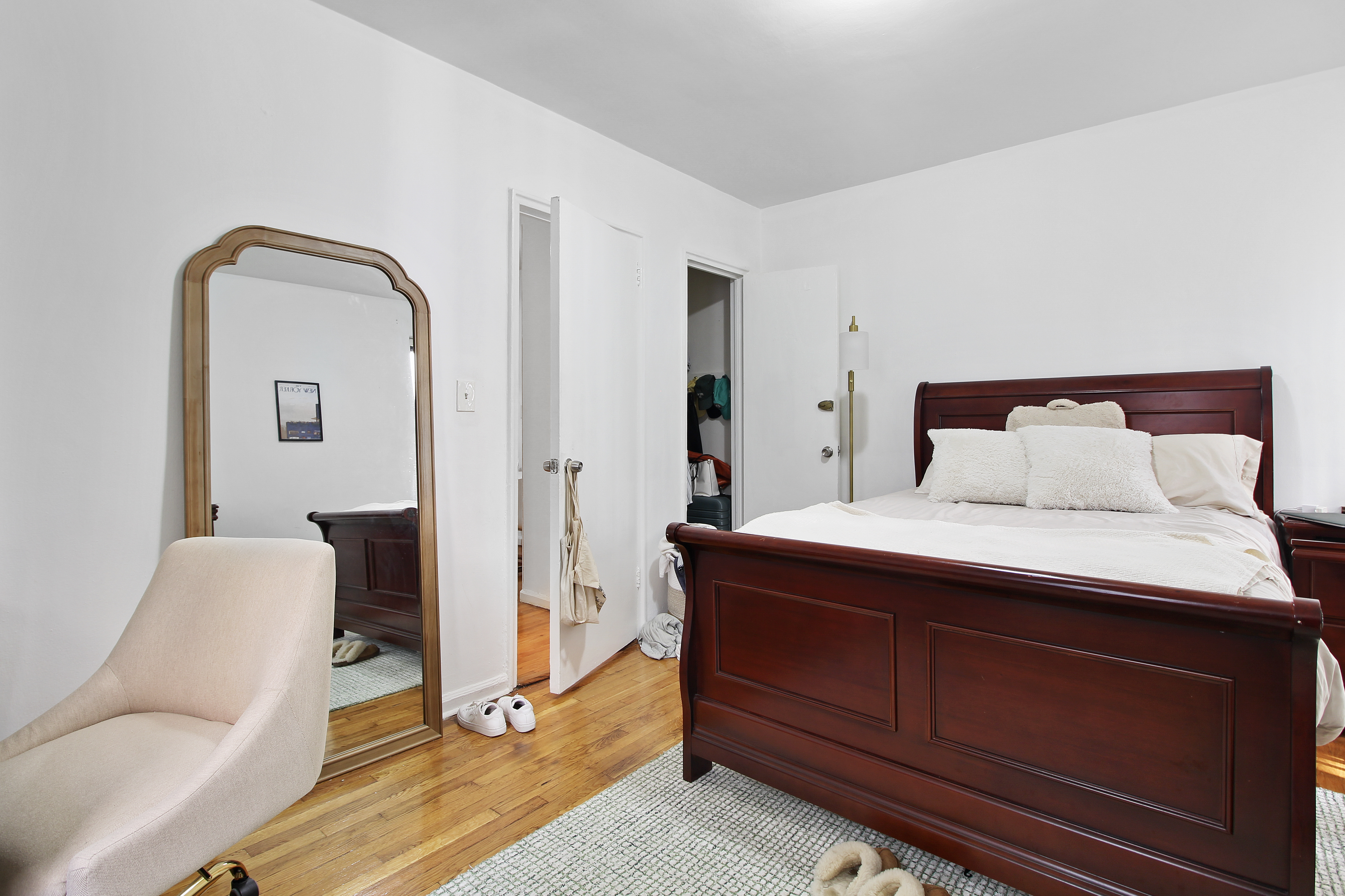 315 East 56th Street, Unit 5F Manhattan, NY 10022 - Photo 6 of 9 a bedroom with a bed and a dresser