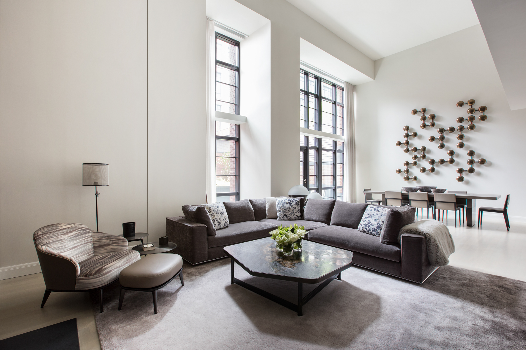 150 Charles Street, Unit M10 Manhattan, NY 10014 - Photo 5 of 34 a living room with furniture and a large window