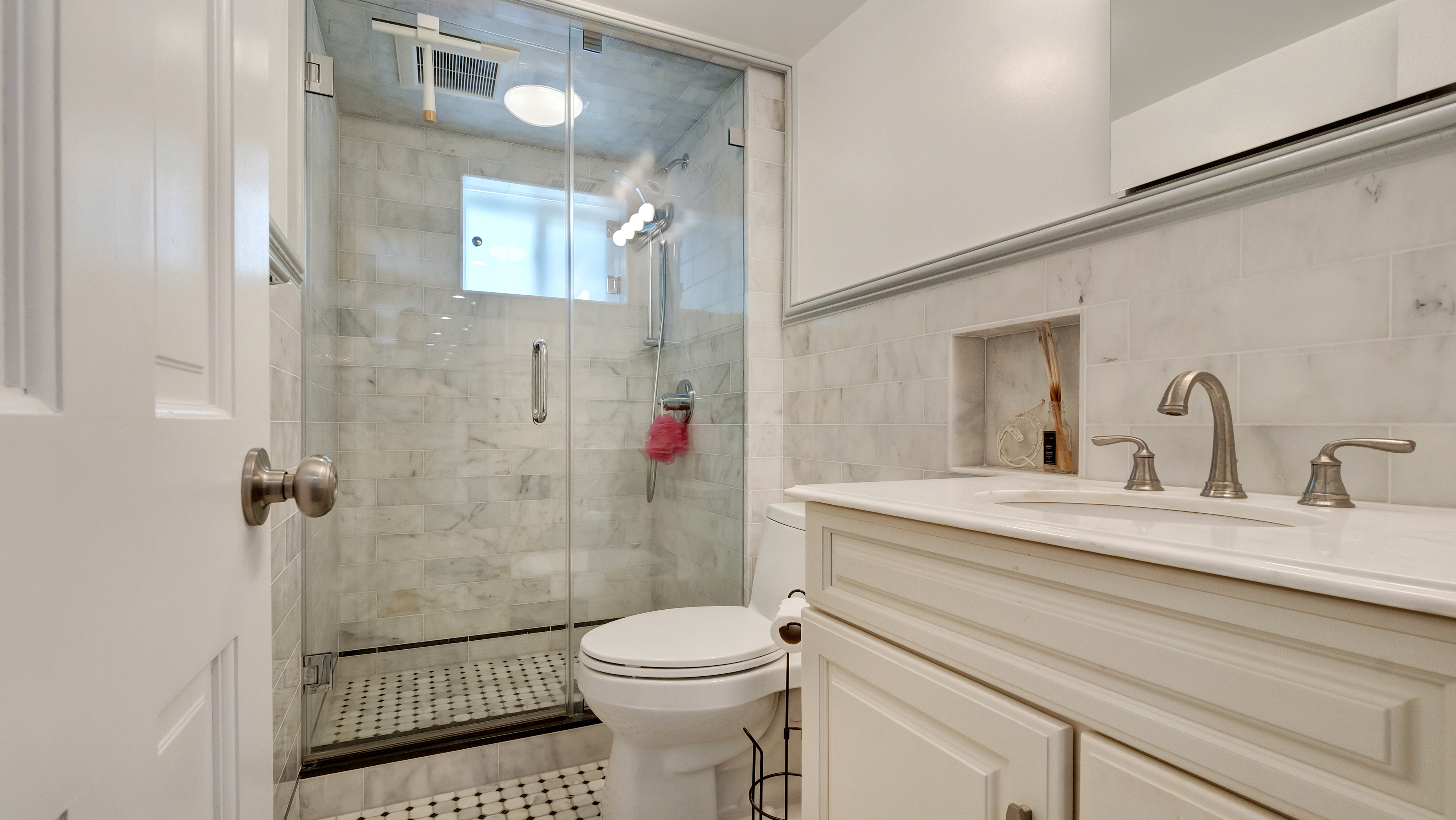 278 Amherst Street Brooklyn, NY 11235 - Photo 11 of 24 a bathroom with a sink toilet and shower