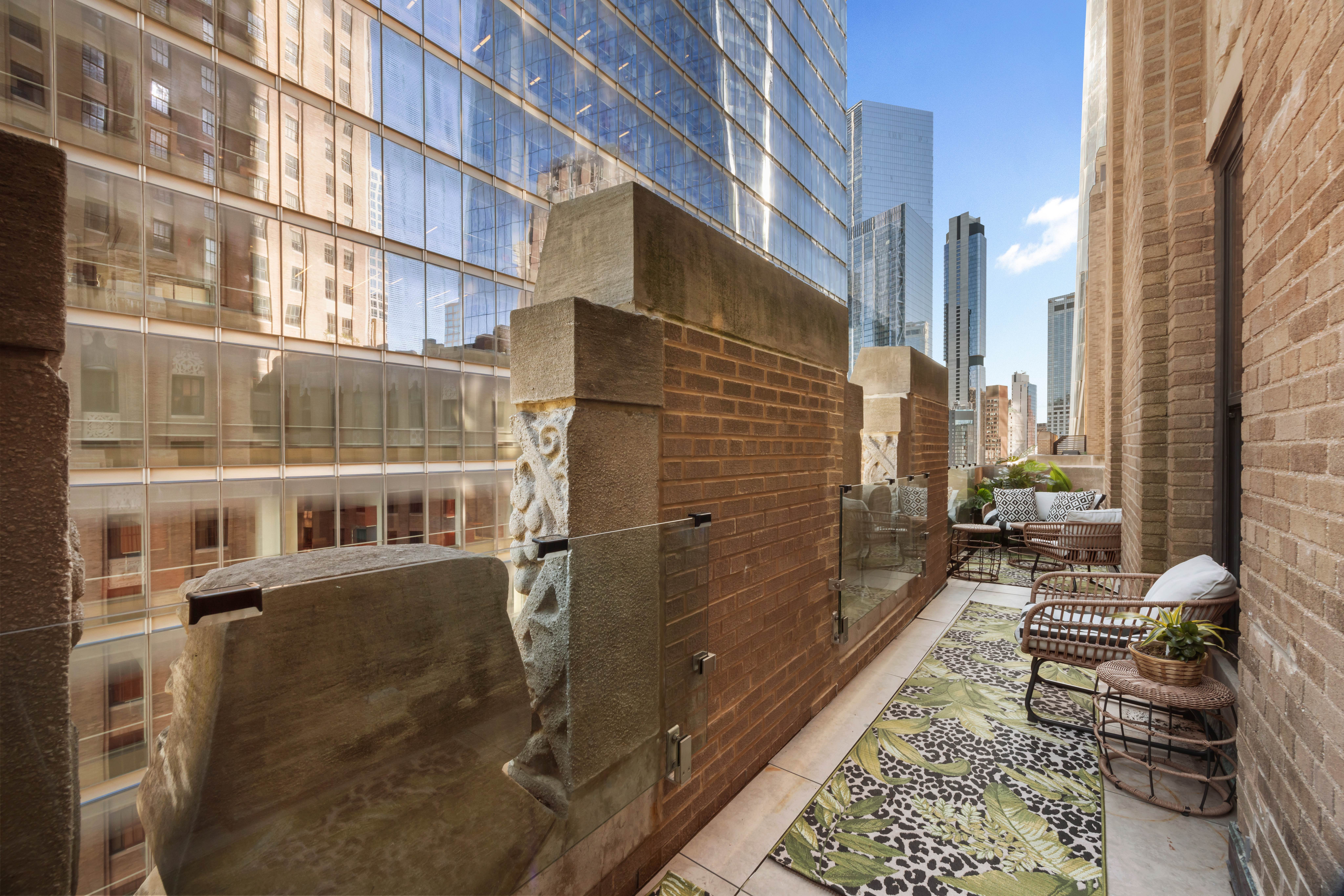 100 Barclay Street, Unit 16G Manhattan, NY 10007 - Photo 3 of 28 a city street lined with tall buildings