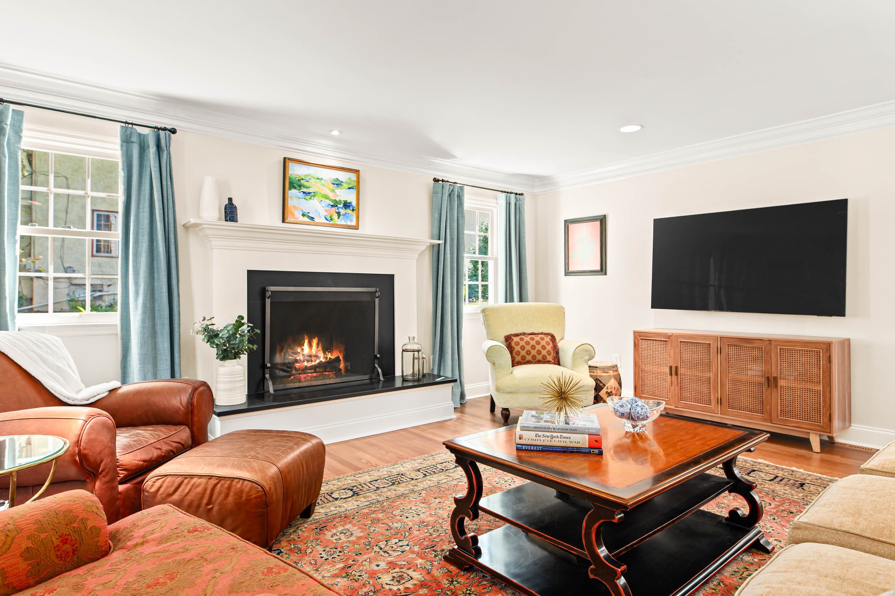 1136 Seaton Ross Road Wayne, PA 19087 - Photo 6 of 48 a living room with furniture a flat screen tv and a fireplace