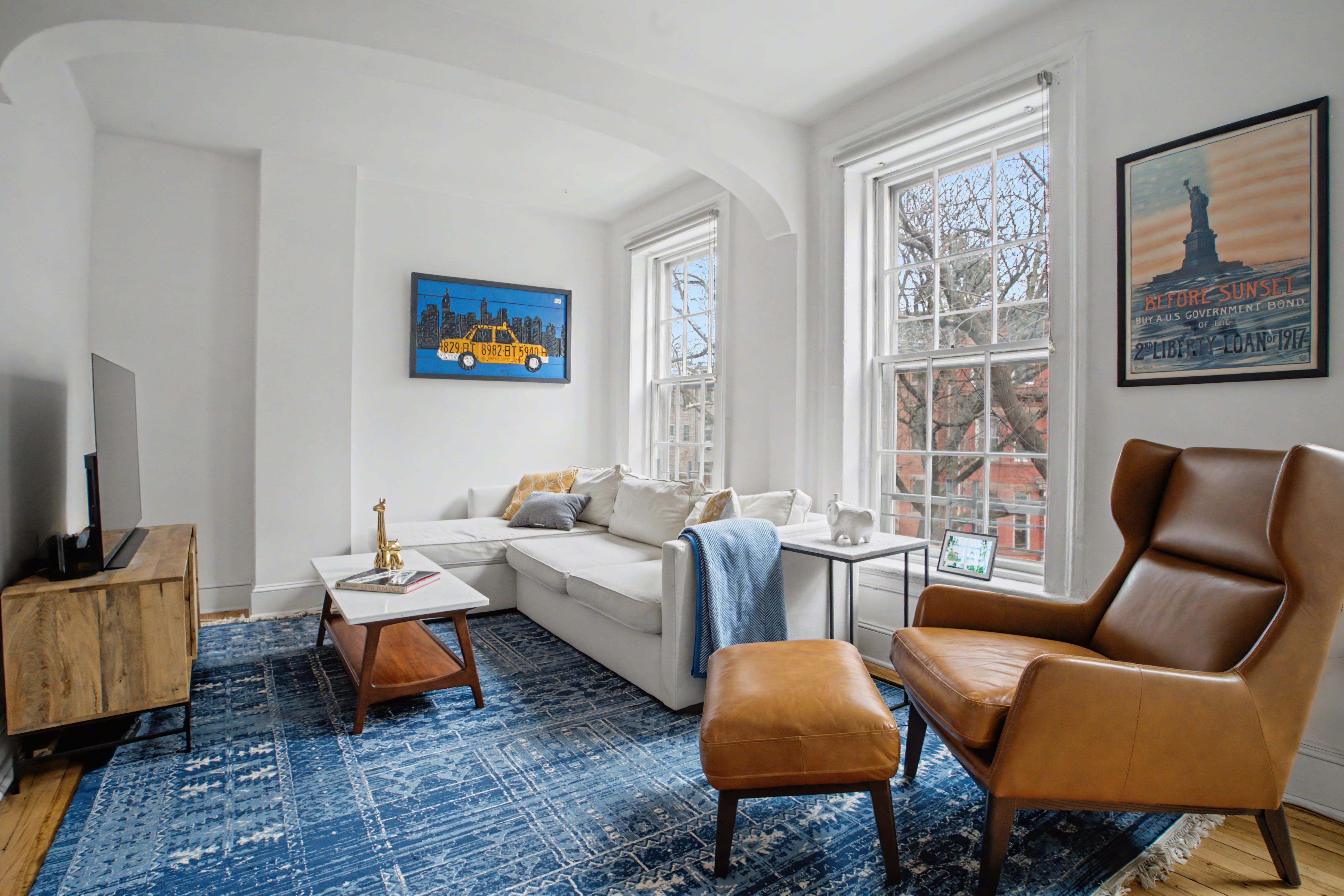 246 Cumberland Street, Unit 2 Brooklyn, NY 11205 - Photo 3 of 15 a living room with furniture and a rug