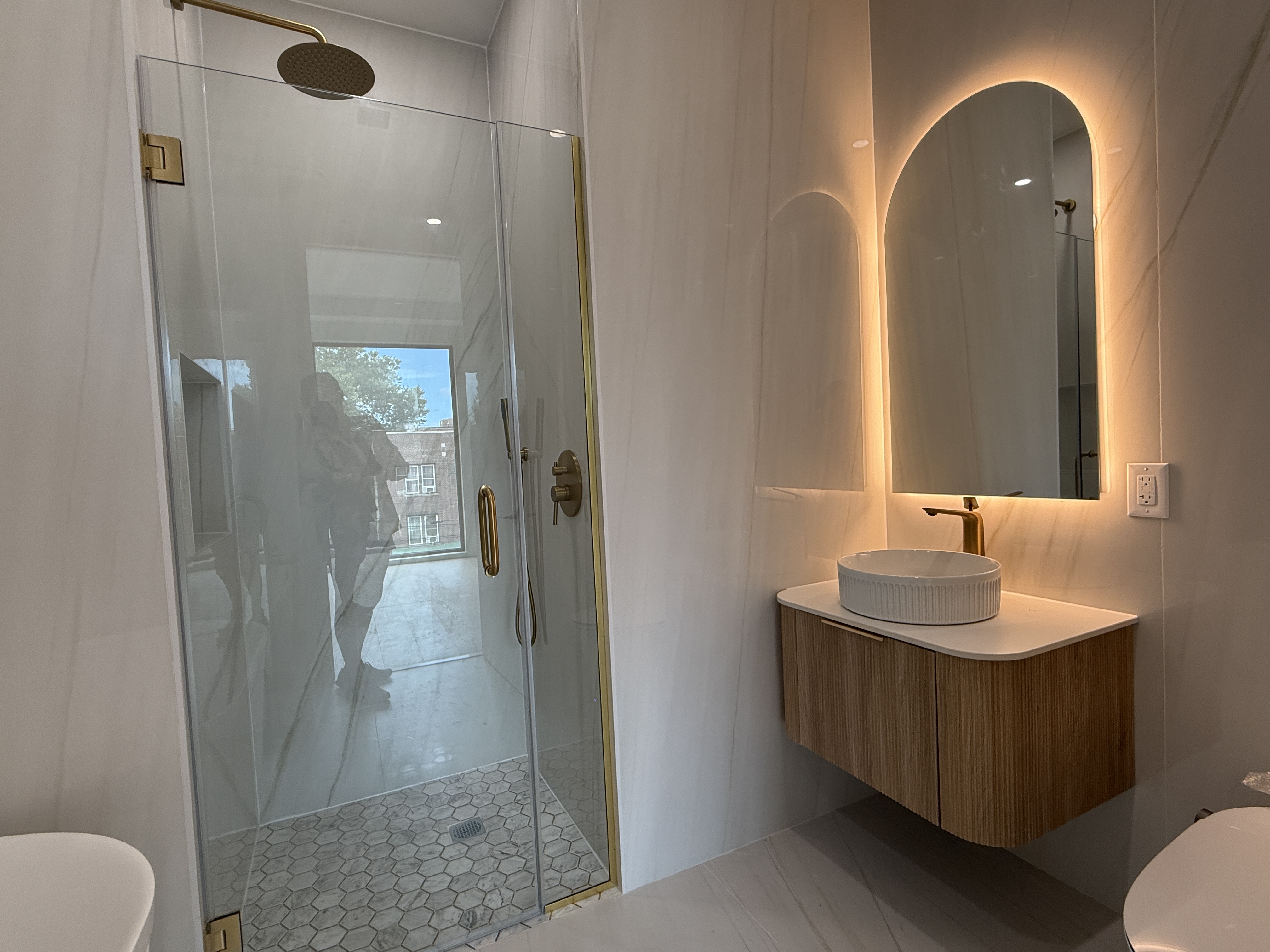 31-16 21st Street, Unit 3E Queens, NY 11106 - Photo 7 of 17 a bathroom with a sink and a mirror