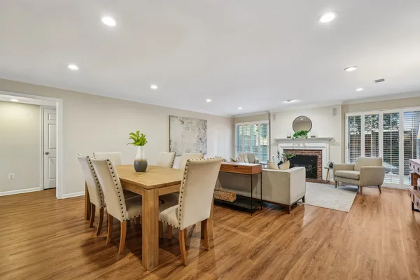 a view of a dining room with furniture window and wooden floor
