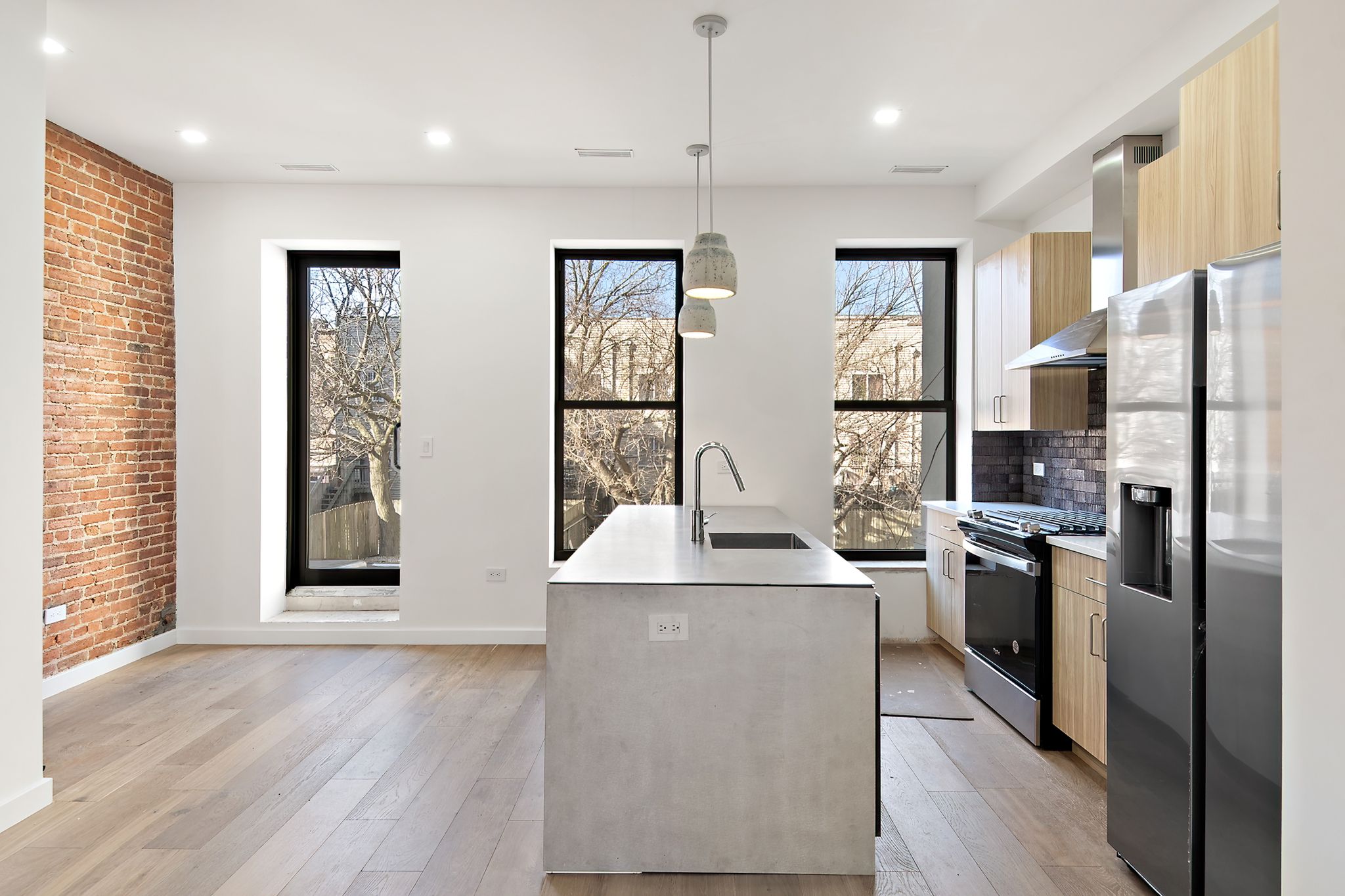 181 Kosciuszko Street Brooklyn, NY 11216 - Photo 2 of 20 a kitchen with stainless steel appliances granite countertop a refrigerator a stove and a refrigerator